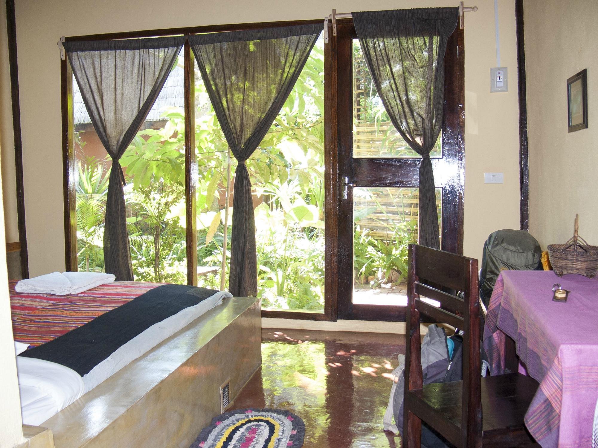 Garden view bungalow surrounded by lush tropical landscaping and native plants