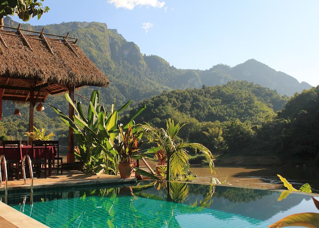 Infinity pool during golden hour with perfect reflections