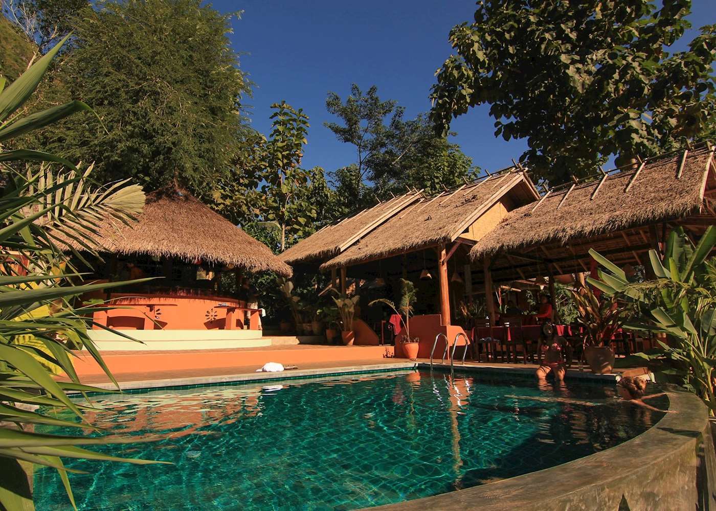 Infinity pool panoramic view with limestone karsts in background