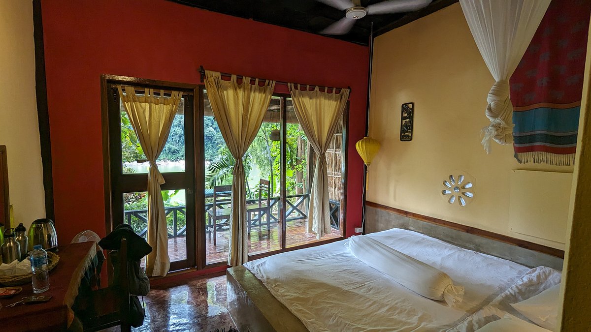 Exterior view of river view bungalow with private balcony overlooking Nam Ou river